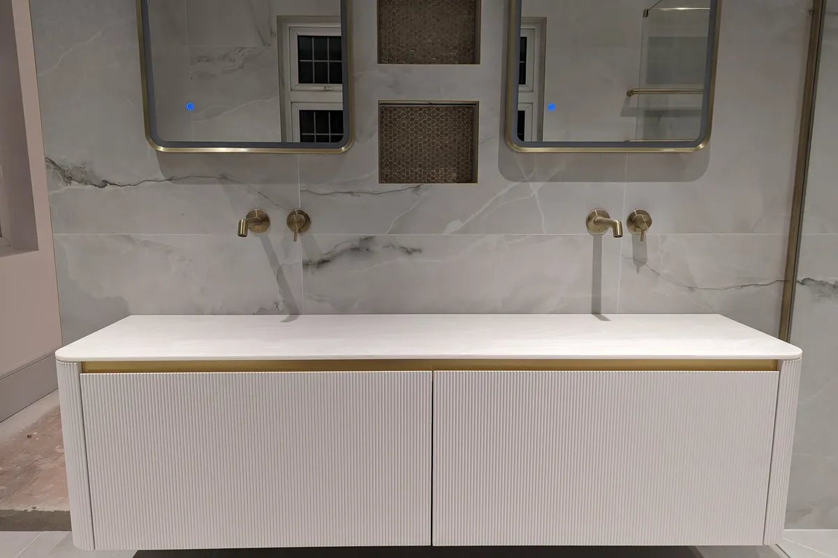 wide double bathroom unit with two mirrors